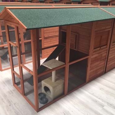 Front and side photo of a small cat boarding suite.